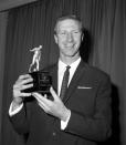 FILE - In this May 18, 1967 file photo Leeds United's England international Jack Charlton holds his award after being elected Footballer of the Year by the Football Writers' Association at the Association's annual dinner at the Cafe Royal, London. Jack Charlton, who won the World Cup with England in 1966, has died it was announced on Saturday July 11, 2020. He was 85. (PA via AP)