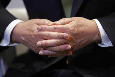 The hands of United Nations Secretary-General Ban Ki-moon are seen during an interview with Reuters during the World Climate Change Conference 2015 (COP21) in Le Bourget, near Paris, France, December 12, 2015. REUTERS/Jacky Naegelen
