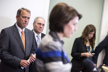 Speaker of the House John Boehner (R-OH) and House Majority Whip Steve Scalise (R-LA) listen to Cathy McMorris Rodgers (R-WA) speak during a press conference calling for for U.S. President Barack Obama not to veto the Keystone XL pipeline on Capitol Hill in Washington November 18, 2014. REUTERS/Joshua Roberts