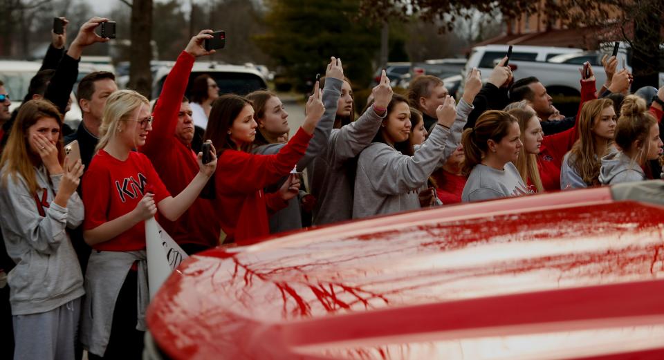 Members of KIVA Sports mourn during  a procession for Lesley Prather and her daughter, Rhyan, along with Carrie McCaw and her daughter, Kacey. All four were killed in a car crash in Missouri.Feb. 17, 2020