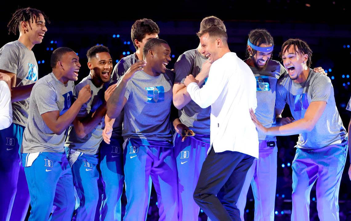 Duke head coach Jon Scheyer laughs with the players after dancing after being introduced during Duke’s Countdown to Craziness at Cameron Indoor Stadium in Durham, N.C., Friday, Oct. 21, 2022. Ethan Hyman/ehyman@newsobserver.com