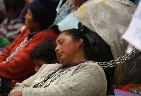 Residents of the town Cerro de Pasco in the Peruvian Andes chained themselves outside of the health ministry to protest for what they describe as rampant pollution from a sprawling polymetallic mine operated by Peruvian mining company Volcan, in Lima, Peru June 22, 2017. REUTERS/Mariana Bazo