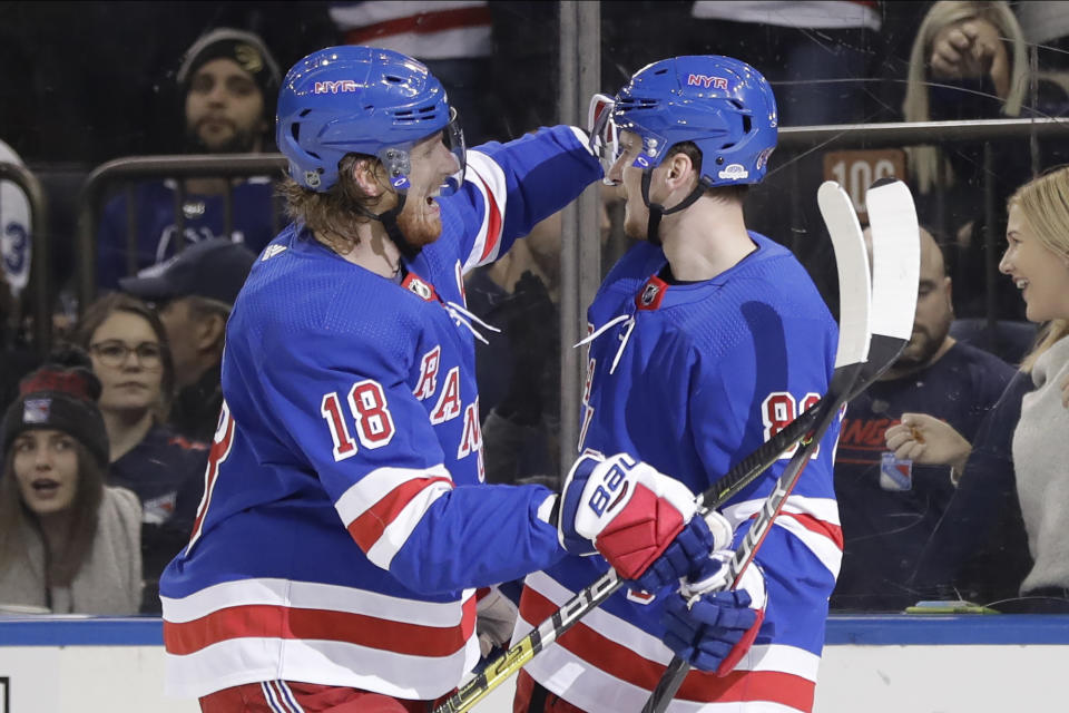 New York Rangers' Marc Staal, left, hugs Pavel Buchnevich after Buchnevich scored during the second period of an NHL hockey game against the Toronto Maple Leafs, Friday, Dec. 20, 2019, in New York. (AP Photo/Frank Franklin II)