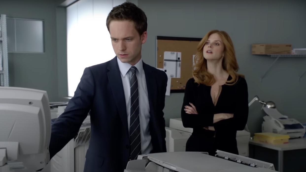  Patrick J. Adams and Sarah Rafferty in Suits. 