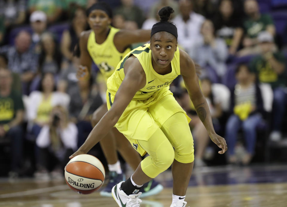 Seattle Storm's Jewell Loyd brings the ball up against the Las Vegas Aces during the first half of a WNBA basketball game Friday, July 19, 2019, in Seattle. (AP Photo/Elaine Thompson)