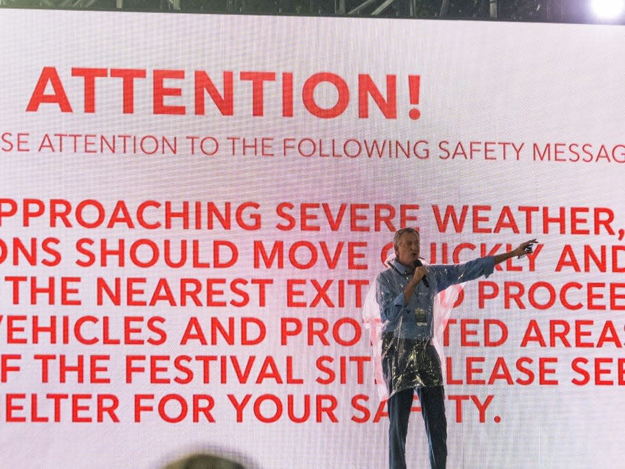New York City Mayor Bill de Blasio tells the crowd to leave in front of an "safety message" warning after the We Love NYC: The Homecoming Concert was cancelled due to storms from Hurricane Henri, on the Great Lawn in Central Park on August 21, 2021