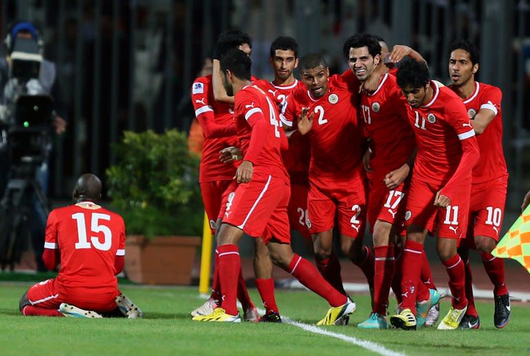 Bahraini players celebrate after scoring against Iraq during their Gulf Cup match in Manama, January 15, 2013. In the match to decide third place, hosts Bahrain take on 10-time champions Kuwait