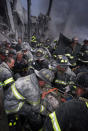 <p>A fireman screams in pain as he is rescued shortly after both towers of New York's World Trade Center collapsed following a terrorist attack, Tuesday, Sept. 11, 2001. (Robert Mecea/Newsday via AP)</p> 