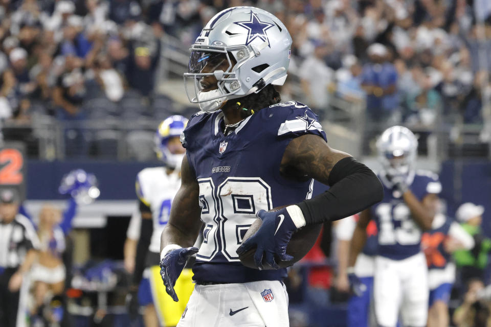 Dallas Cowboys wide receiver CeeDee Lamb celebrates scoring a touchdown during the first half of an NFL football game against the Los Angeles Rams, Sunday, Oct. 29, 2023, in Arlington, Texas. (AP Photo/Michael Ainsworth)