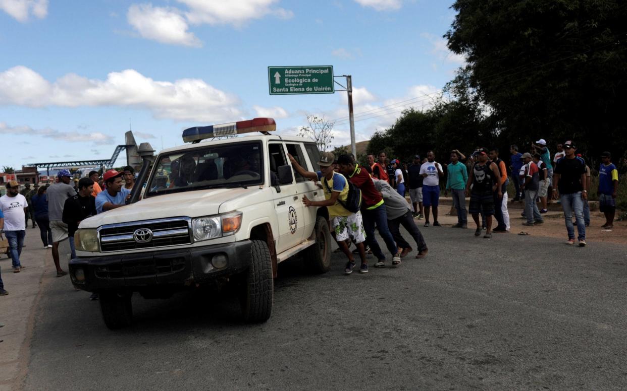 An ambulance carrying people injured during the border clashes - REUTERS