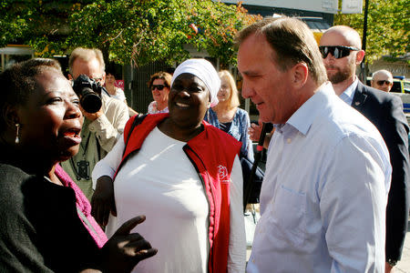 Sweden's Prime Minister Stefan Lofven speaks with people during his campaign in the Farsta neighbourhood in Stockholm, Sweden September 3, 2018. REUTERS/Daniel Dickson