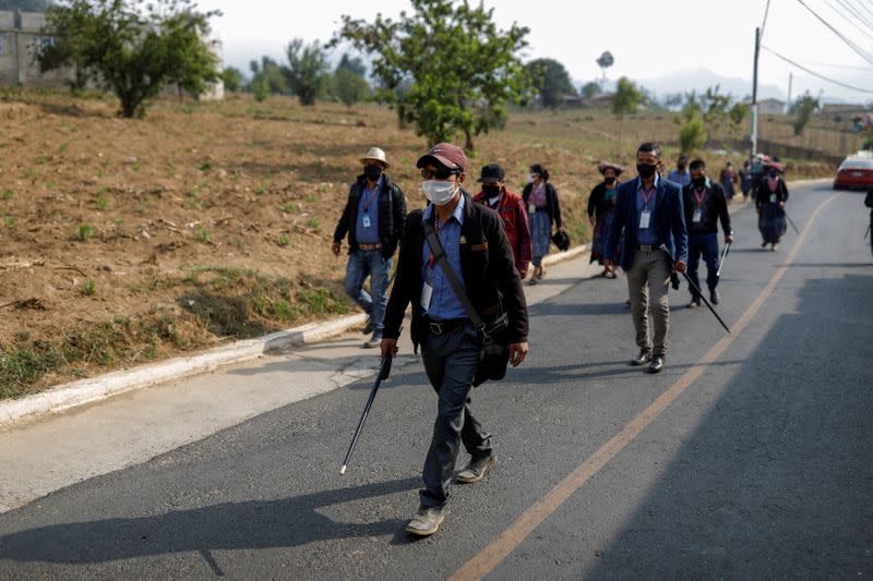 Community members patrol the village of Pasajoc amid the outbreak of the coronavirus disease (COVID-19), in Totonicapan