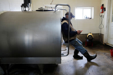 Dairy farmer Fred Stone sits against the empty milk storage container, after discovering the soil, hay, and the milk from the cows on the farm contain extremely high levels of PFAS chemicals resulting from a 1980's state program to fertilize the pastures with treated sludge waste and making the milk unsuitable for sale, at the Stoneridge Farm in Arundel, Maine, U.S., March 11, 2019. Picture taken March 11, 2019. REUTERS/Brian Snyder