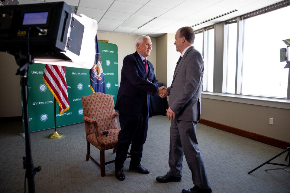 Former Vice President Mike Pence shakes hands with Boyd Matheson of KSL Newsradio after an interview at the Zions Bank Building in Salt Lake City on Friday, April 28, 2023. | Spenser Heaps, Deseret News