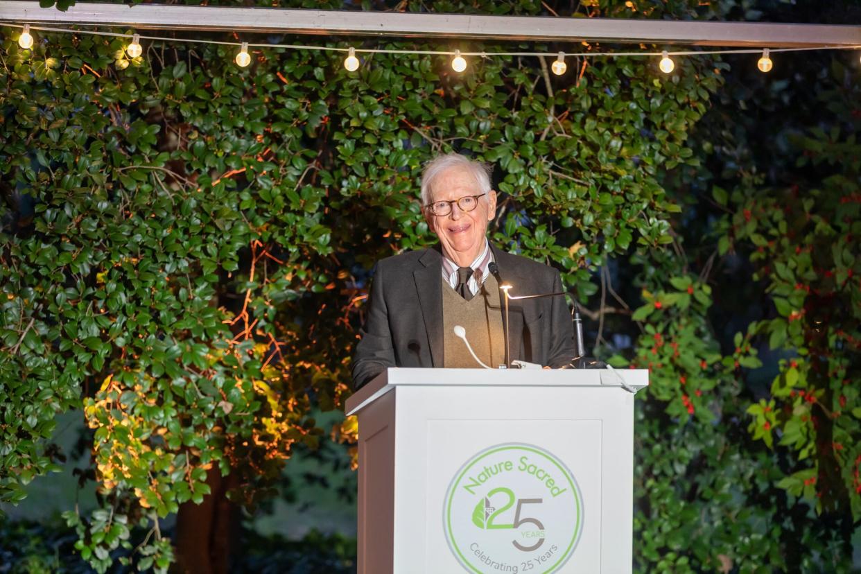 Tom Stoner makes a speech during a celebration of Nature Sacred, the nonprofit he co-founded with his wife, Kitty.