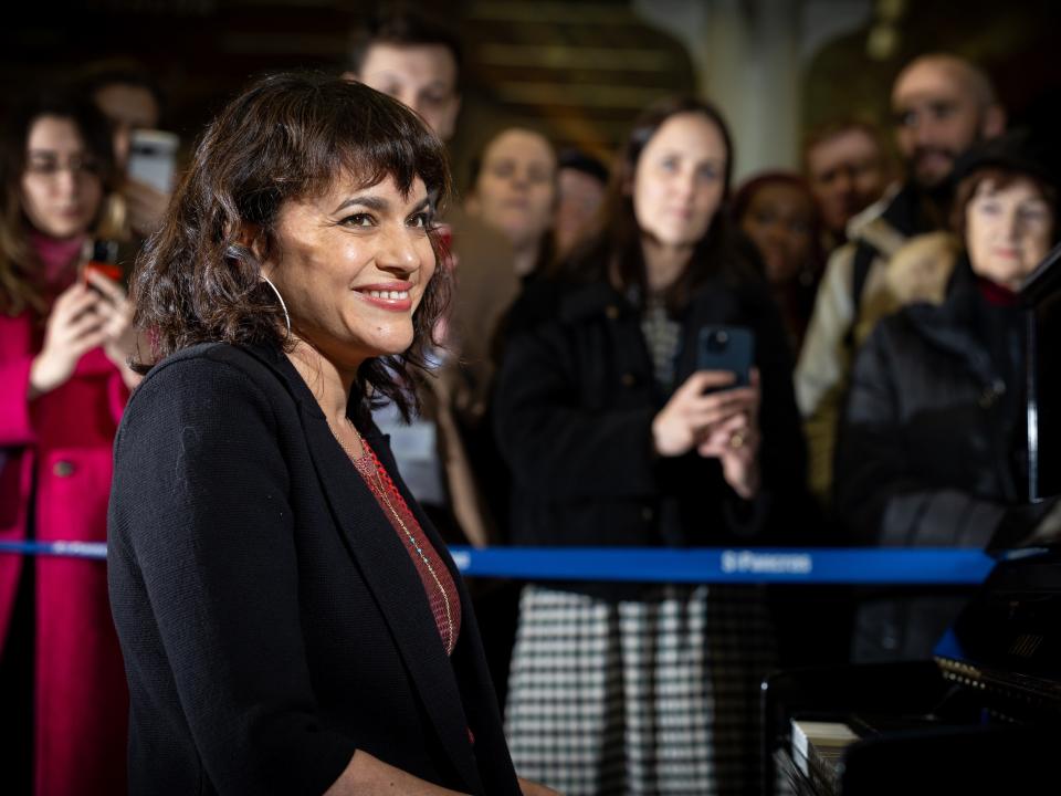 Norah Jones performs on Elton John's Piano at King's Cross St. Pancras Station in March 2024.