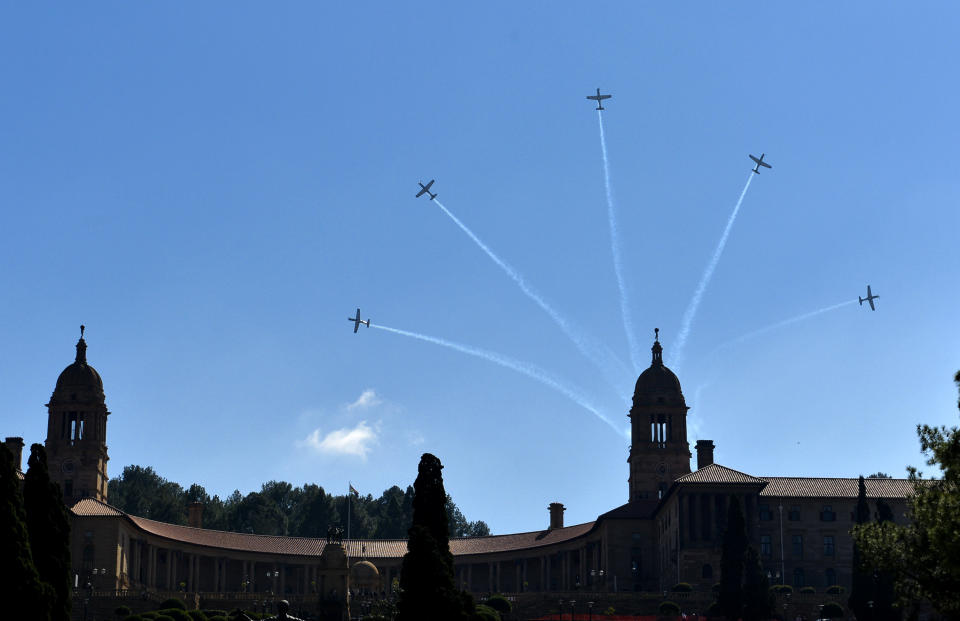 Aircraft perform a flyover above the government's Union Buildings in Pretoria, South Africa, during 20-year Democracy Anniversary celebrations, Sunday, April 27, 2014. The day marks the end of the apartheid era when all races went to the polls to cast their votes in historic 1994 elections. (AP Photo)