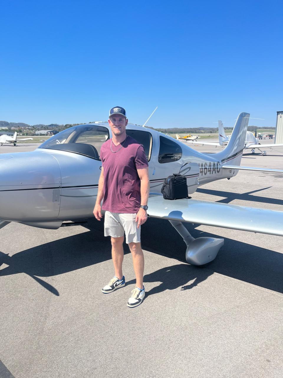 Titans QB Ryan Tannehill poses in front of plane in summer 2023, the summer he earned his private pilot's license.