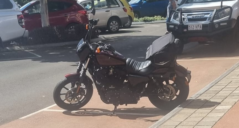 The motorcycle in the parking bays. 