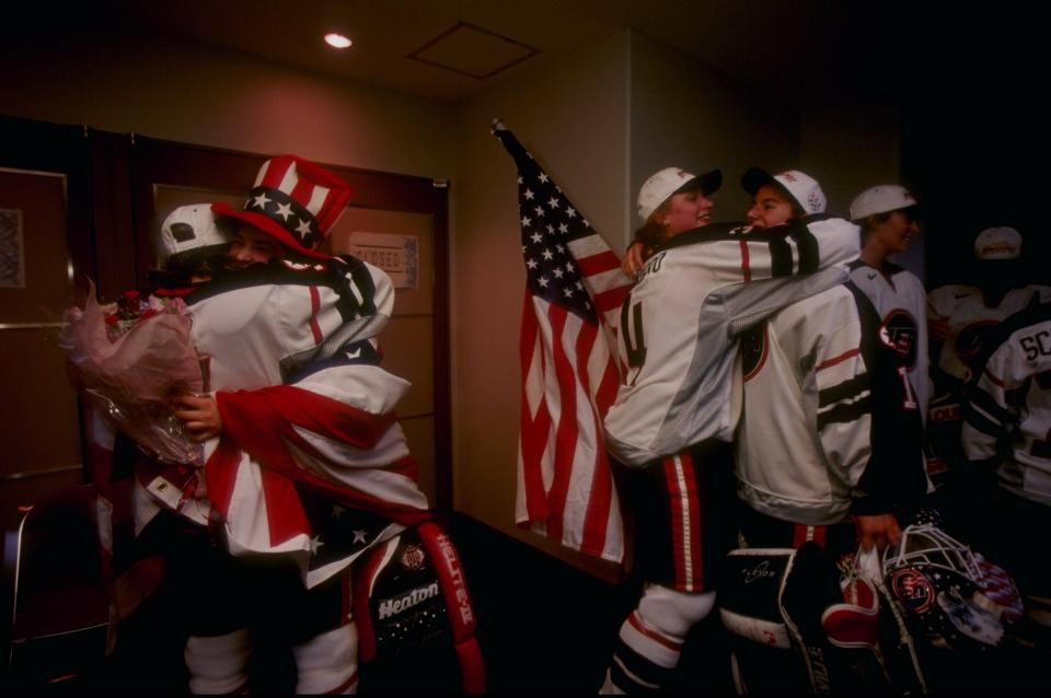 United States women's hockey team members celebrate in the locker room a victory over Canada in women''s ice hockey during the Winter Olympics in Nagano, Japan on Feb. 17, 1998. The team earned the first-ever gold medal for women's hockey in an Olympic Games.