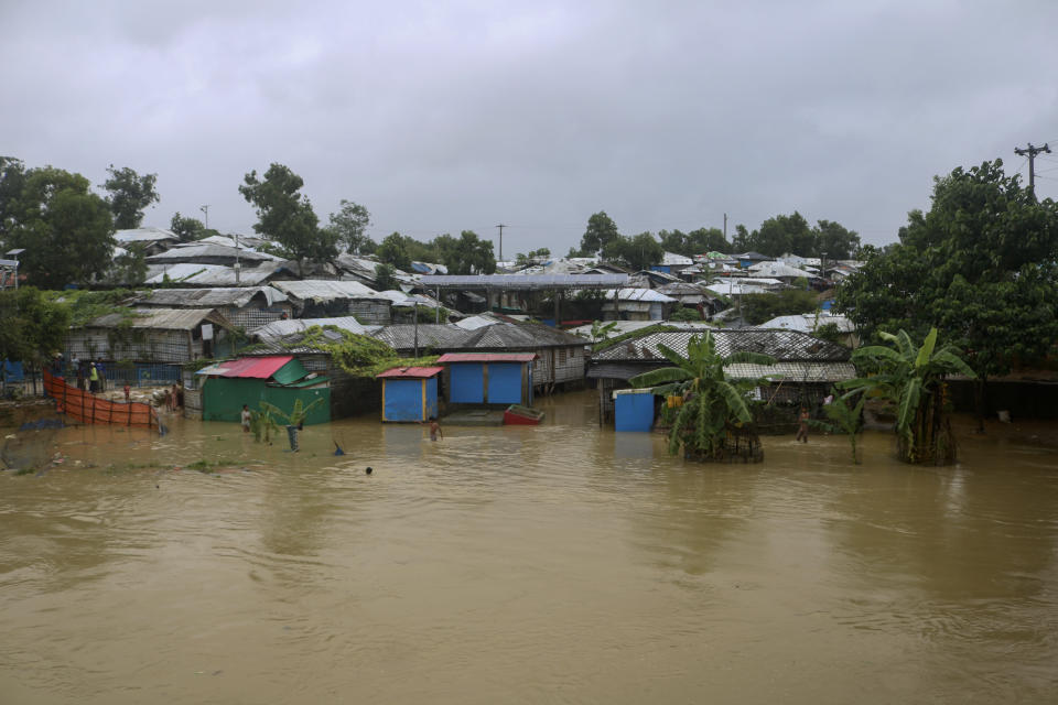 A view of inundated shelters following heavy rains at the Rohingya refugee camp in Kutupalong, Bangladesh, Wednesday, July 28, 2021. Days of heavy rains have brought thousands of shelters in various Rohingya refugee camps in Southern Bangladesh under water, rendering thousands of refugees homeless. (AP Photo/ Shafiqur Rahman)