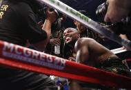 <p>Floyd Mayweather Jr. smiles as he sits in his corner in between rounds REUTERS/Steve Marcus </p>