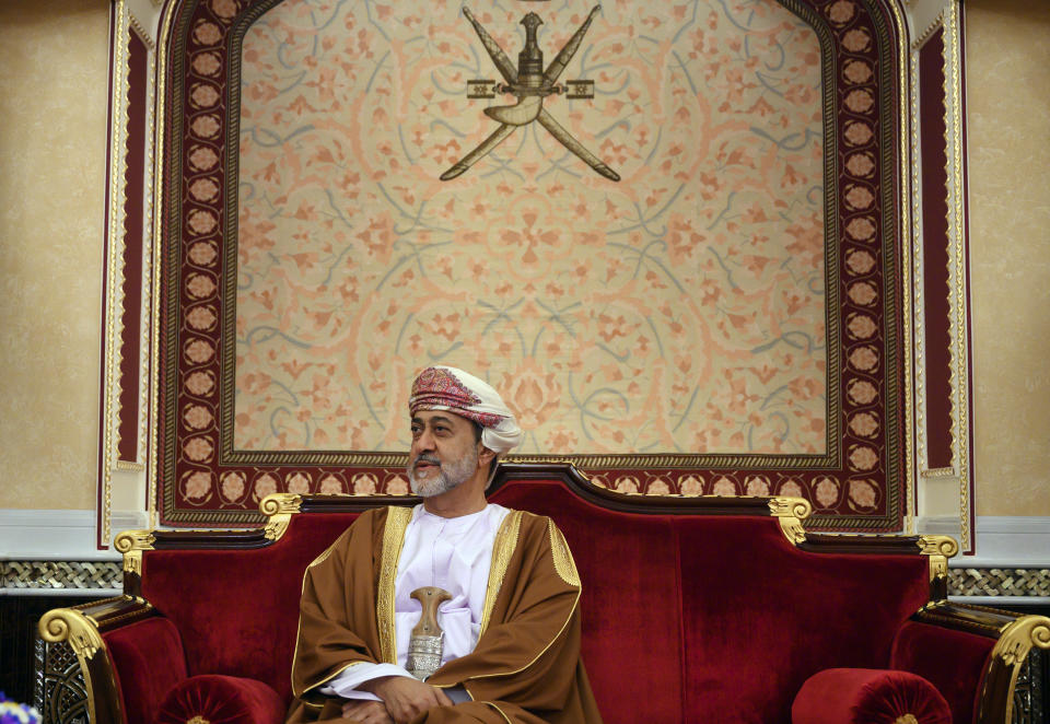 FILE - In this Feb. 21, 2020 file photo, Oman's ruler Sultan Haitham bin Tariq prepares for a meeting at al-Alam palace in the capital Muscat, Oman. The sultan announced Monday, Jan. 11, 2021, a shake-up of the country’s constitution with changes that include the appointment of a crown prince for the first time and steps to boost government transparency. The move, one year after the death of Sultan Qaboos bin Said comes as the government faces growing economic pressures at home. (Andrew Caballero-Reynolds/Pool via AP, File)