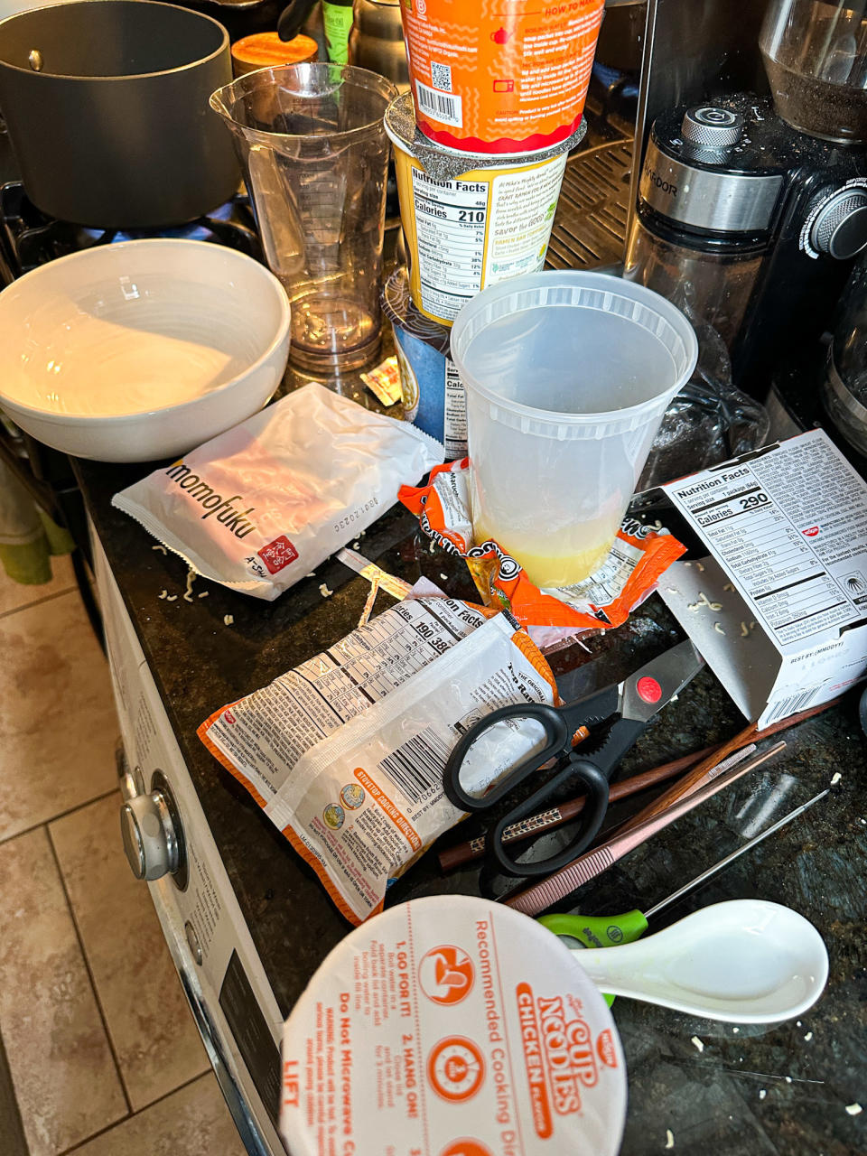various ramen packaging and bowls strewn about author's counter