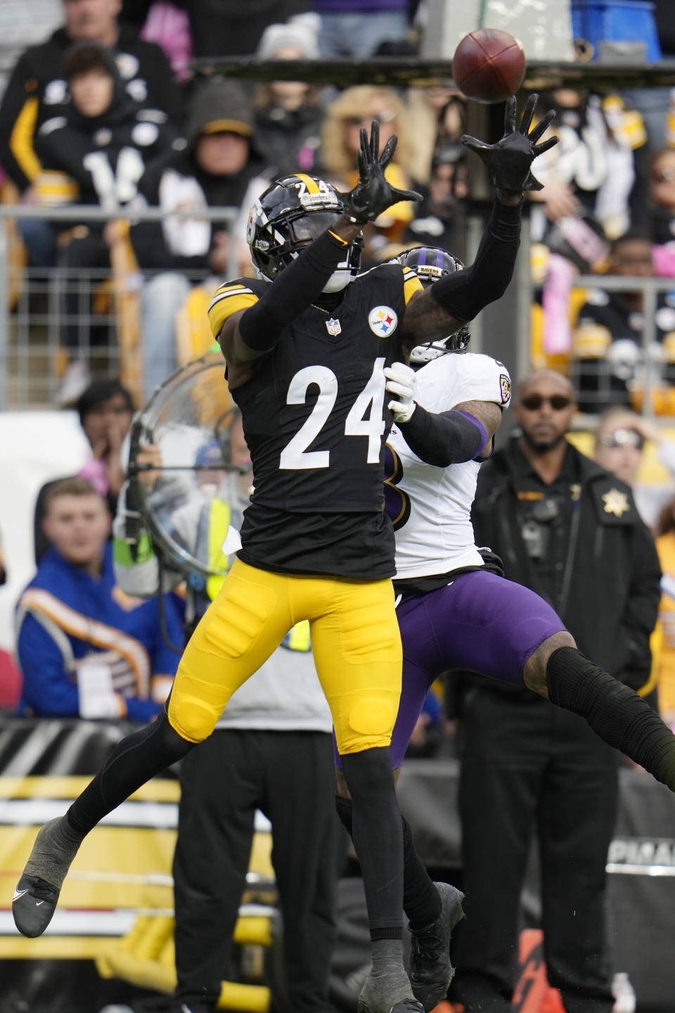 Pittsburgh Steelers cornerback Joey Porter Jr. (24) intercepts a pass intended for Baltimore Ravens wide receiver Odell Beckham Jr., right, in the second half of an NFL football game in Pittsburgh, Sunday, Oct. 8, 2023. (AP Photo/Gene J. Puskar)