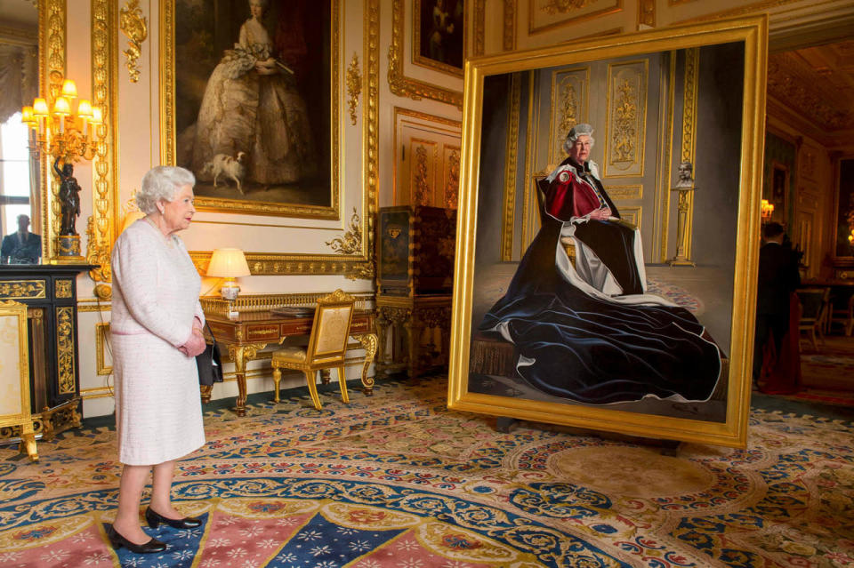 Britain’s Queen Elizabeth views a portrait of herself