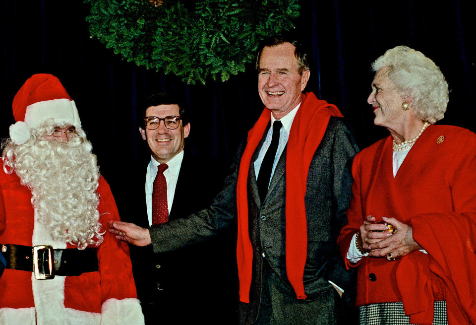 President-elect George H.W. Bush and Barbara Bush visit the inaugural headquarters and look at a jar of jelly beans that are for sale on Dec. 19, 1988.