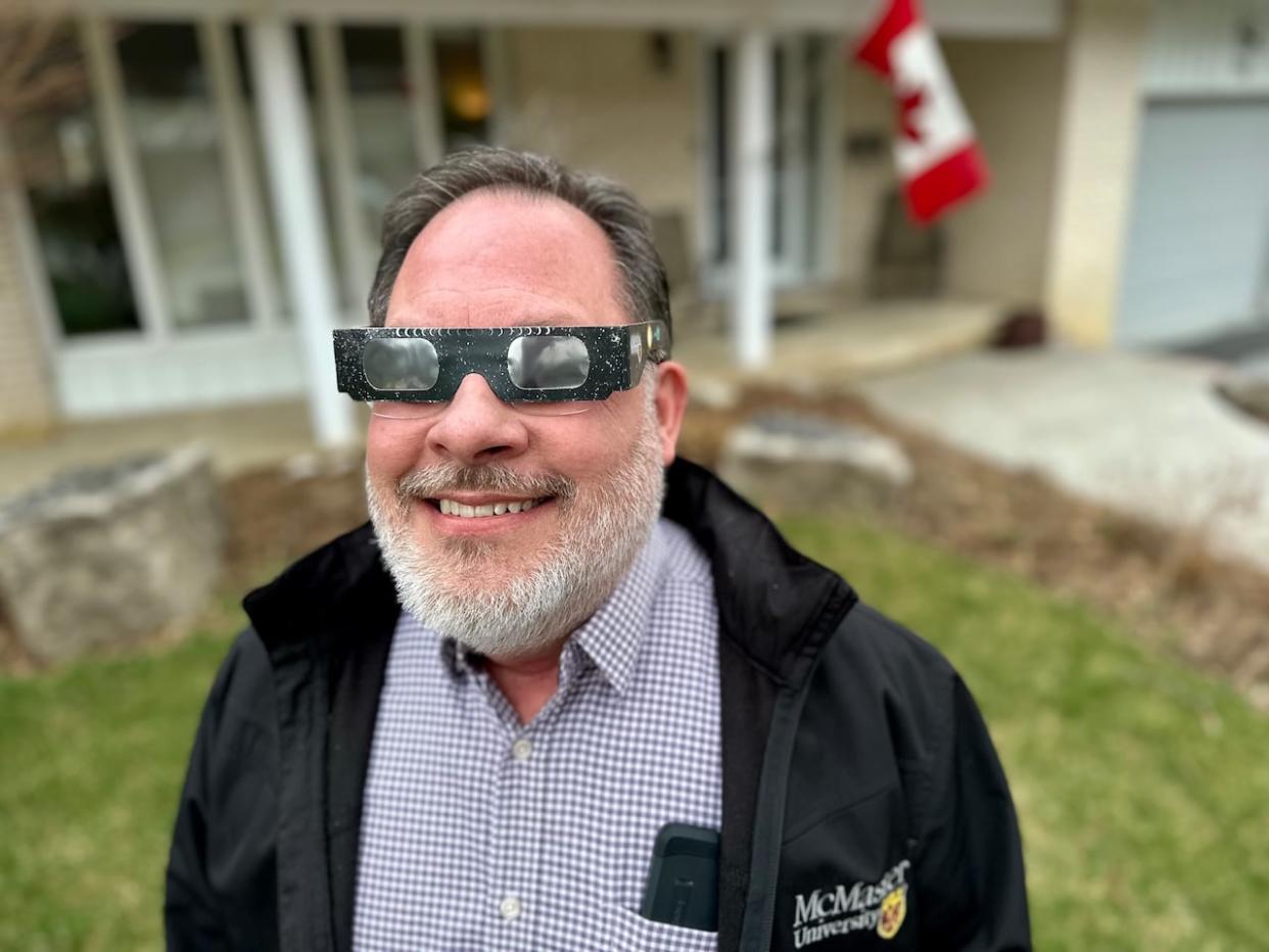 Eric Seidlitz stands outside his Dundas, Ont., home where he will be watching the total solar eclipse on Monday, his 60th birthday. He was diagnosed with cancer in 2019 but was deemed in remission in April 2020. (Samantha Beattie/CBC - image credit)