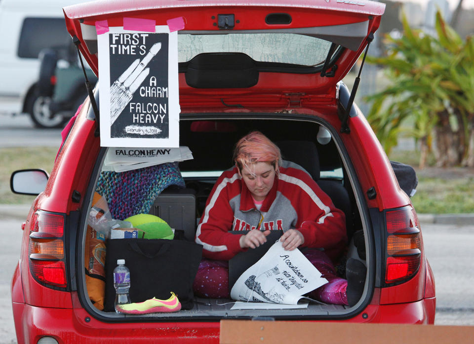 <p>Indiana University student Constance Strawn of Bloomington, Indiana, gets ready to watch her first SpaceX launch, several hours before liftoff of the first Falcon Heavy rocket, from a vantage point at Cocoa Beach, Fla., Feb, 6, 2018. (Photo: Gregg Newton/Reuters) </p>