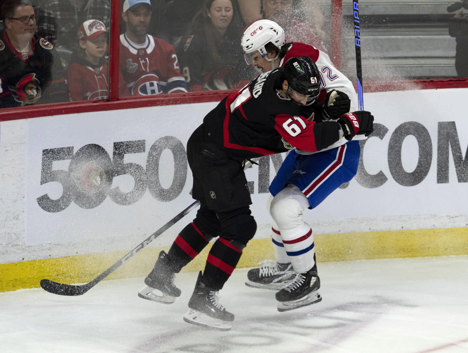 Ottawa Senators center Derick Brassard (61) runs into Montreal Canadiens defenseman Arber Xhekaj during first-period NHL hockey game action Saturday, Jan. 28, 2023, in Ottawa, Ontario. (Adrian Wyld/The Canadian Press via AP)