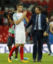 <p>England’s manager Gareth Southgate, right, watches England’s Eric Dier clapping hands after the World Cup Group F qualifying soccer match between England and Slovakia at Wembley Stadium in London, England, Monday, Sept. 4, 2017. (AP Photo/Kirsty Wigglesworth) </p>