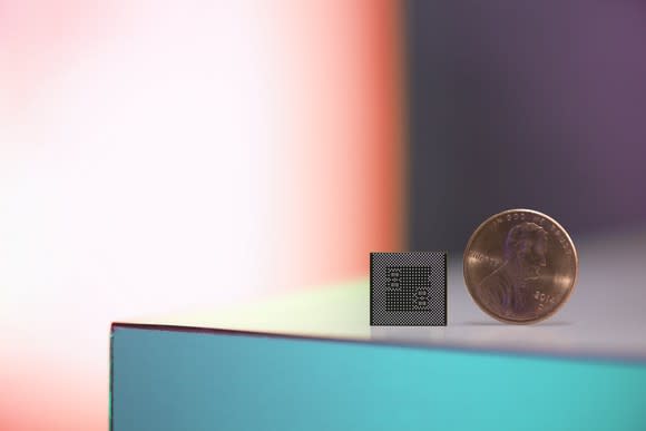 Qualcomm's Snapdragon 835 SoC compared to a penny.