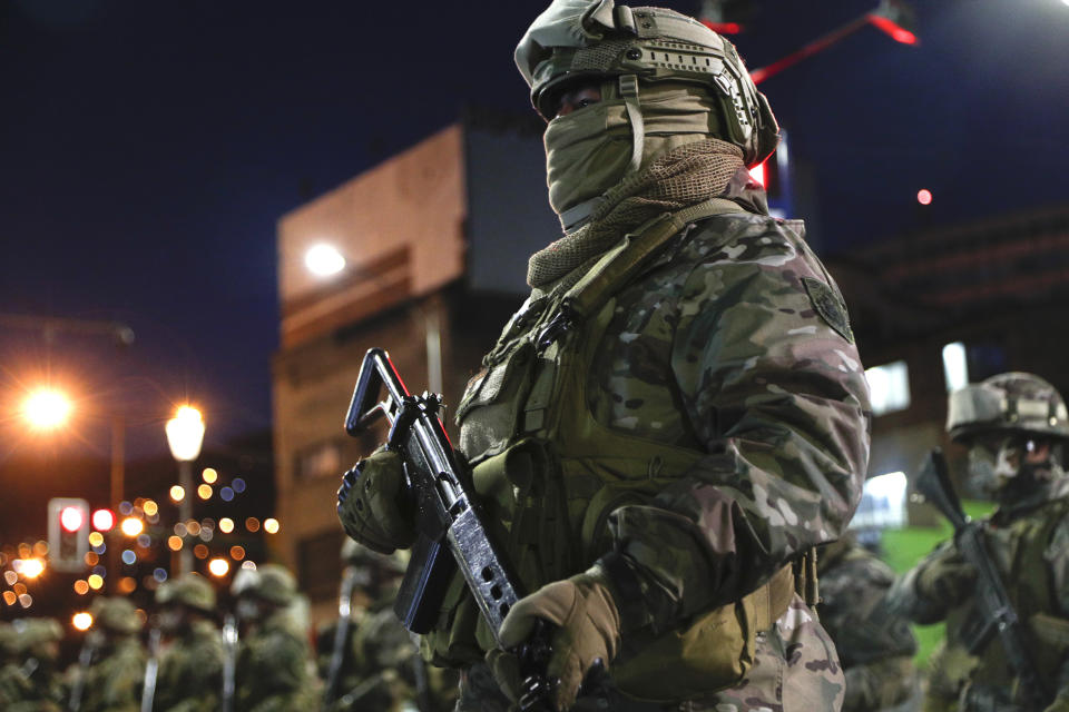 Military police forces guard La Paz, Bolivia, Saturday, Oct. 17, 2020 ahead of Sunday's general election. The upcoming presidential election gives Bolivians a chance for a political reset as they struggle with the dramatic costs of the COVID-19 pandemic. (AP Photo/Juan Karita)