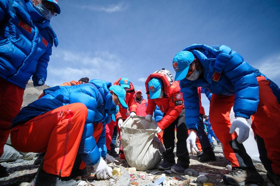 Climbers collect garbage on Mount Everest in 2020.