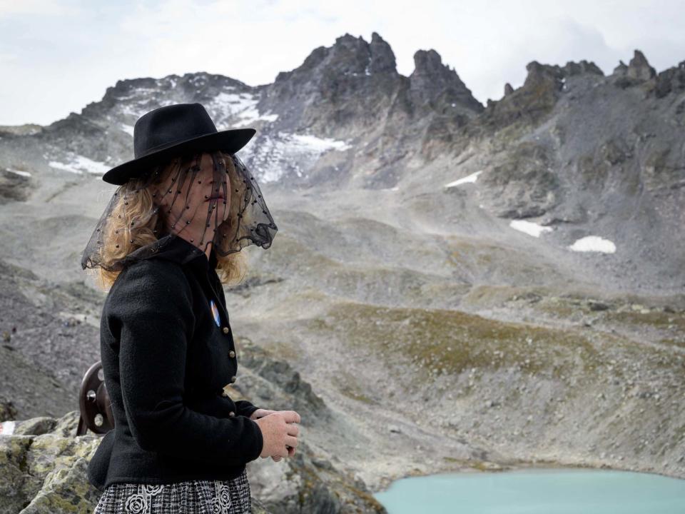 A woman takes part in a ceremony to mark the "death" of the Pizol glacier above Mels, eastern Switzerland: AFP/Getty Images