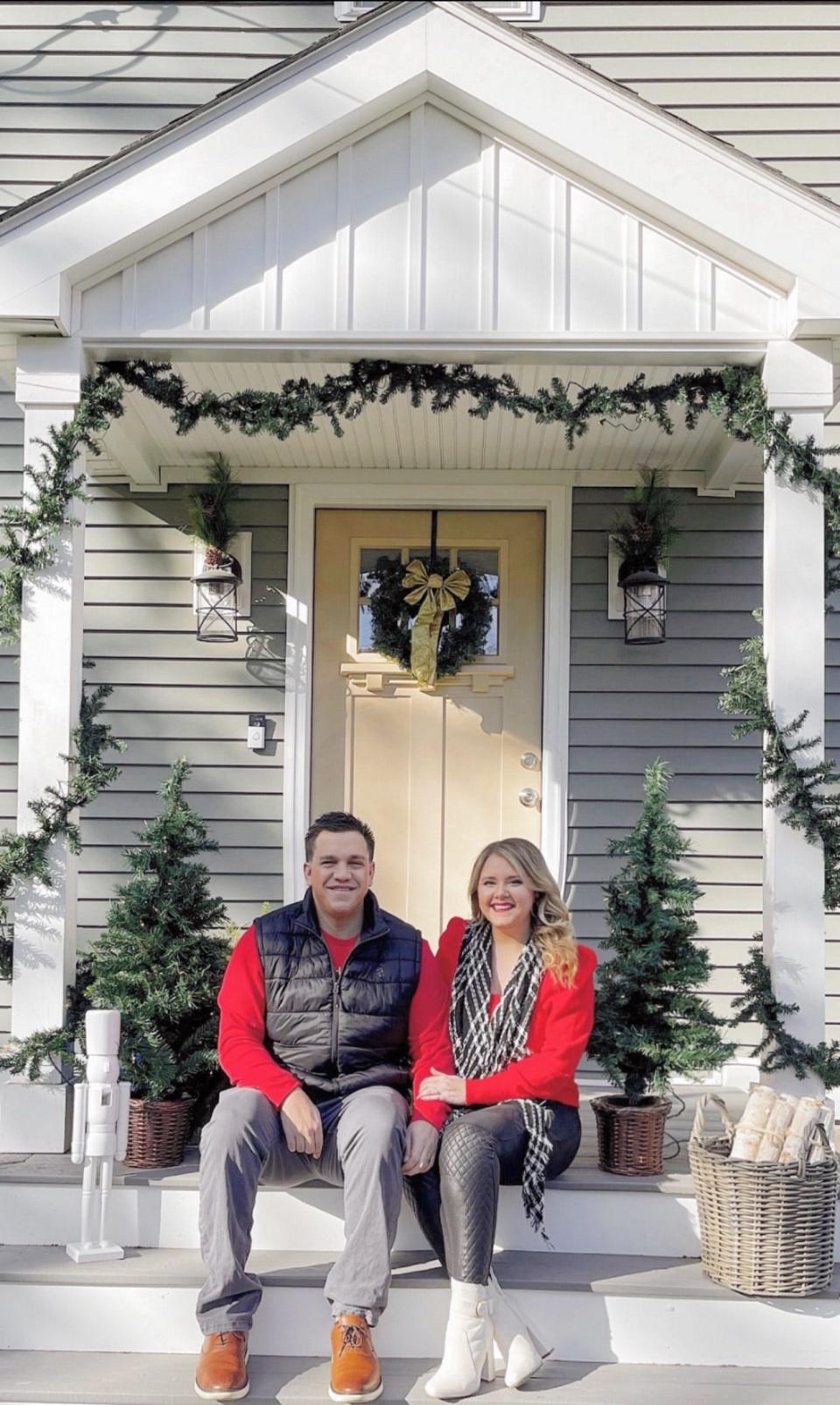 SouthCoast Pumpkin Co. owner and designer Alyssa Joyce and her husband Kurt are a team of two, installing holiday porch designs.