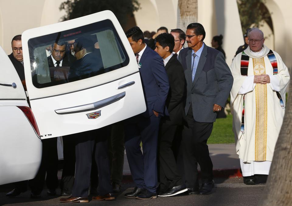 Pall bearers take the casket of former Democratic U.S. Rep. Ed Pastor back to the hearse after a funeral Friday, Dec. 7, 2018, in Phoenix. Pastor was Arizona's first Hispanic member of Congress, spending 23 years in Congress before retiring in 2014. Pastor passed away last week at the age of 75. (AP Photo/Ross D. Franklin)