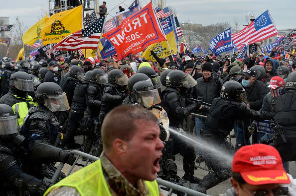 Trump supporters clash with police and security forces as people try to storm the US Capitol in Washington D.C on January 6, 2021. - Demonstrators breeched security and entered the Capitol as Congress debated the a 2020 presidential election Electoral Vote Certification. (Photo by Joseph Prezioso / AFP) (Photo by JOSEPH PREZIOSO/AFP via Getty Images)