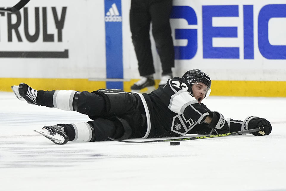 Los Angeles Kings right wing Viktor Arvidsson slides across the ice after tripping during the first period in Game 3 of an NHL hockey Stanley Cup first-round playoff series against the Edmonton Oilers Friday, April 21, 2023, in Los Angeles. (AP Photo/Mark J. Terrill)