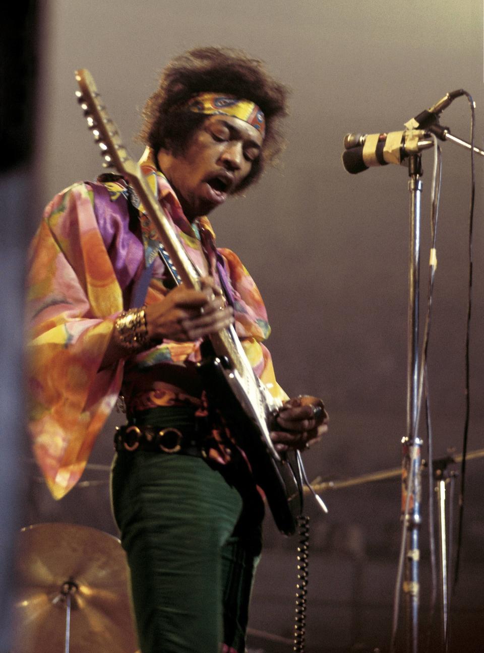 Jimi Hendrix performing onstage