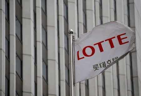 FILE PHOTO: A flag bearing the logo of Lotte Hotel flutters at a Lotte Hotel in Seoul, South Korea, March 25, 2016. REUTERS/Kim Hong-Ji/File Photo