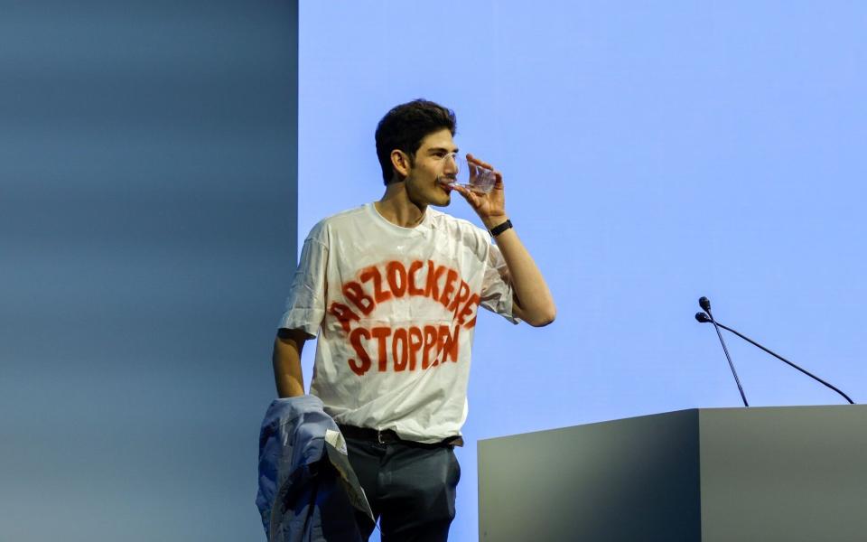 A shareholder wears a t-shirt reading "Stop the Rip Off" at the Credit Suisse AGM - Stefan Wermuth/Bloomberg