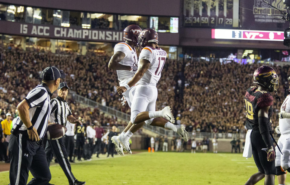 Virginia Tech Hokies wide receiver Damon Hazelton, left, and quarterback quarterback Josh Jackson (17) celebrate a touchdown on their first drive against Florida State. (AP)