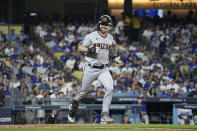 Arizona Diamondbacks' Corbin Carroll smiles as he rounds the bases after hitting a home run during the second inning in Game 1 of a baseball NL Division Series against the Los Angeles Dodgers, Saturday, Oct. 7, 2023, in Los Angeles. (AP Photo/Mark J. Terrill)