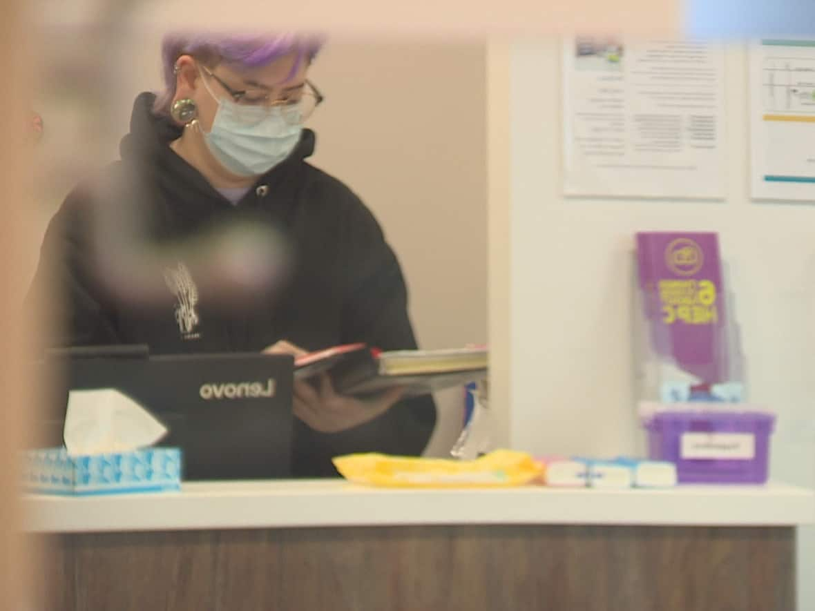 Ezra Hawkins, a registered nurse with the City of Toronto's Supervised Consumption Services, is shown at the harm-reduction site in the Parkdale neighbourhood. Hawkins says collecting and sharing drug checking results with users allows them to be more aware of what's in the drugs they're taking. (Mehrdad Nazarahari/CBC - image credit)