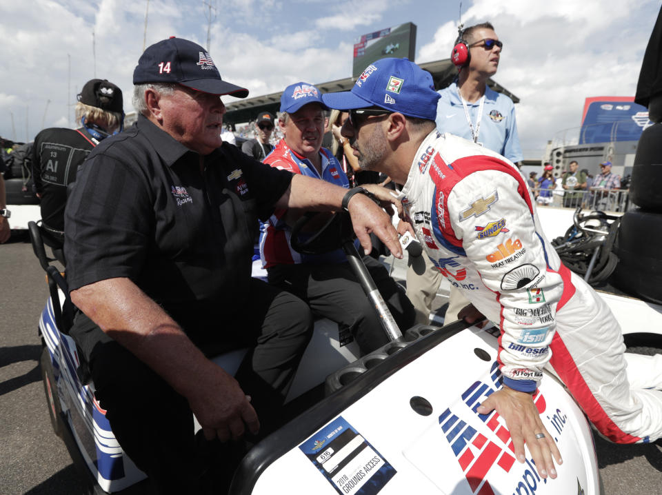 FILE - In this May 19, 2018, file photo, Tony Kanaan, right, of Brazil, talks with car owner AJ Foyt after Kanaan qualified for the Indianapolis 500 auto race at Indianapolis Motor Speedway in Indianapolis. The speedway is closed due to the coronavirus pandemic. (AP Photo/Michael Conroy, File)